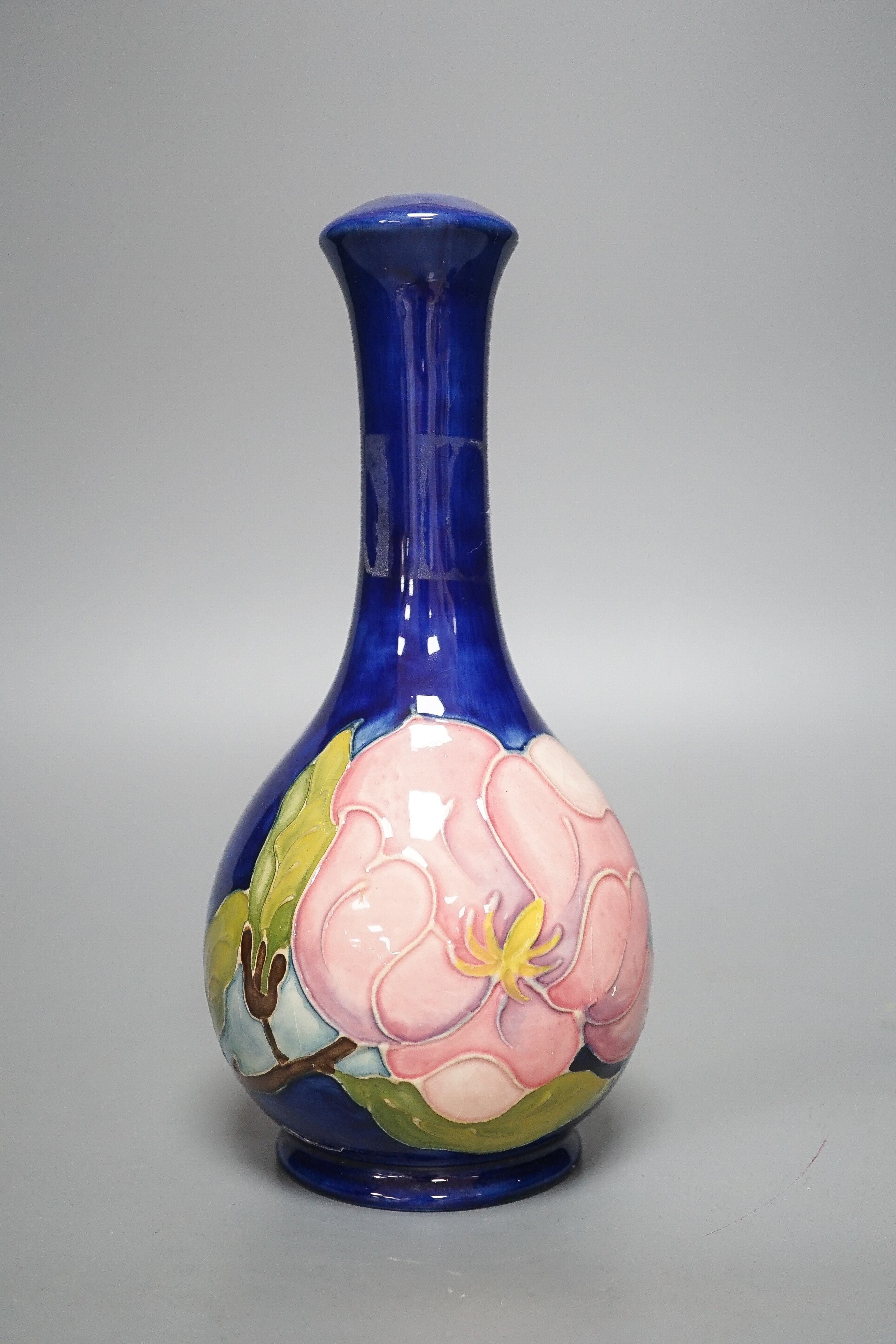 A Moorcroft magnolia pattern bottle vase 22.5cm